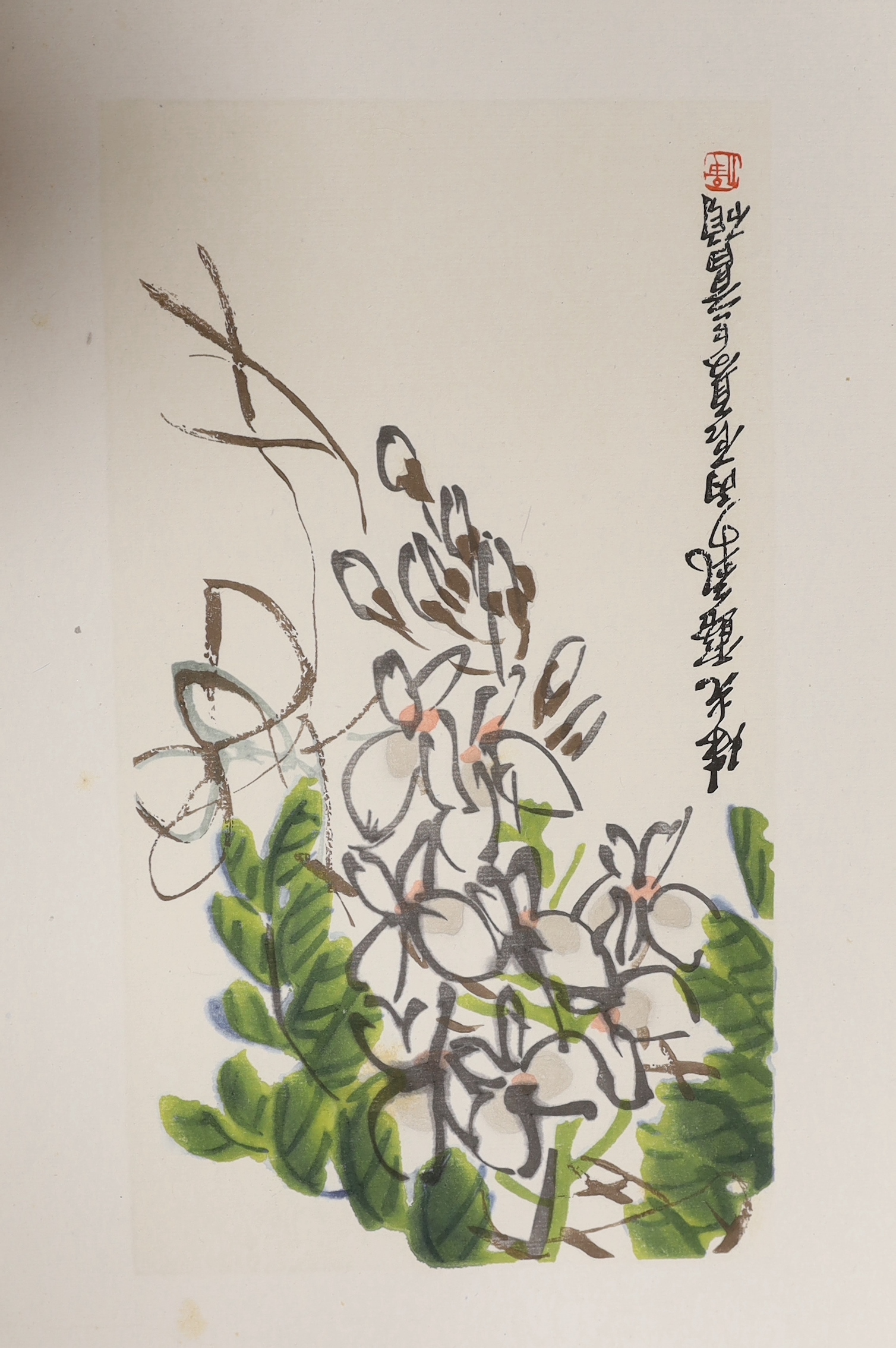 A Chinese album of flower prints Wu Changshuo, published by Cao Bai, 1972, a book of Modern Japanese Art of Flower Arrangements, a fine silk commemorative handkerchief with a printed panel depicting the surrender in 1905